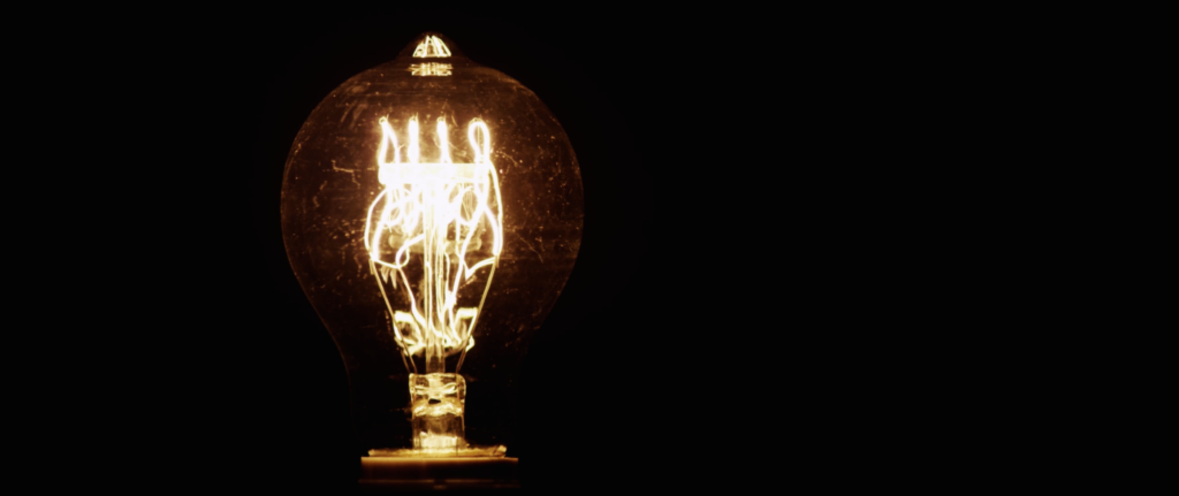 Close up of a illuminated light bulb symbolizing a new app idea.