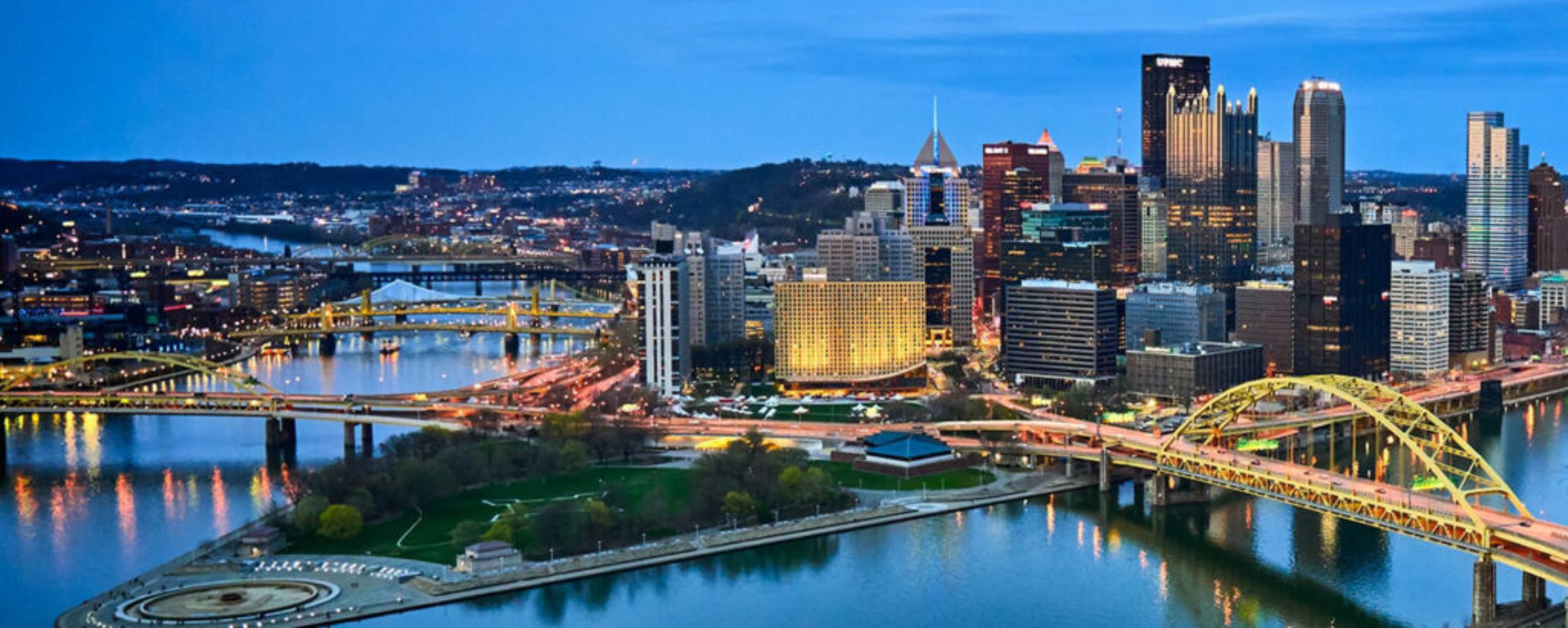 Pittsburgh skyline showing iconic bridges and river, backdrop for PyCon event
