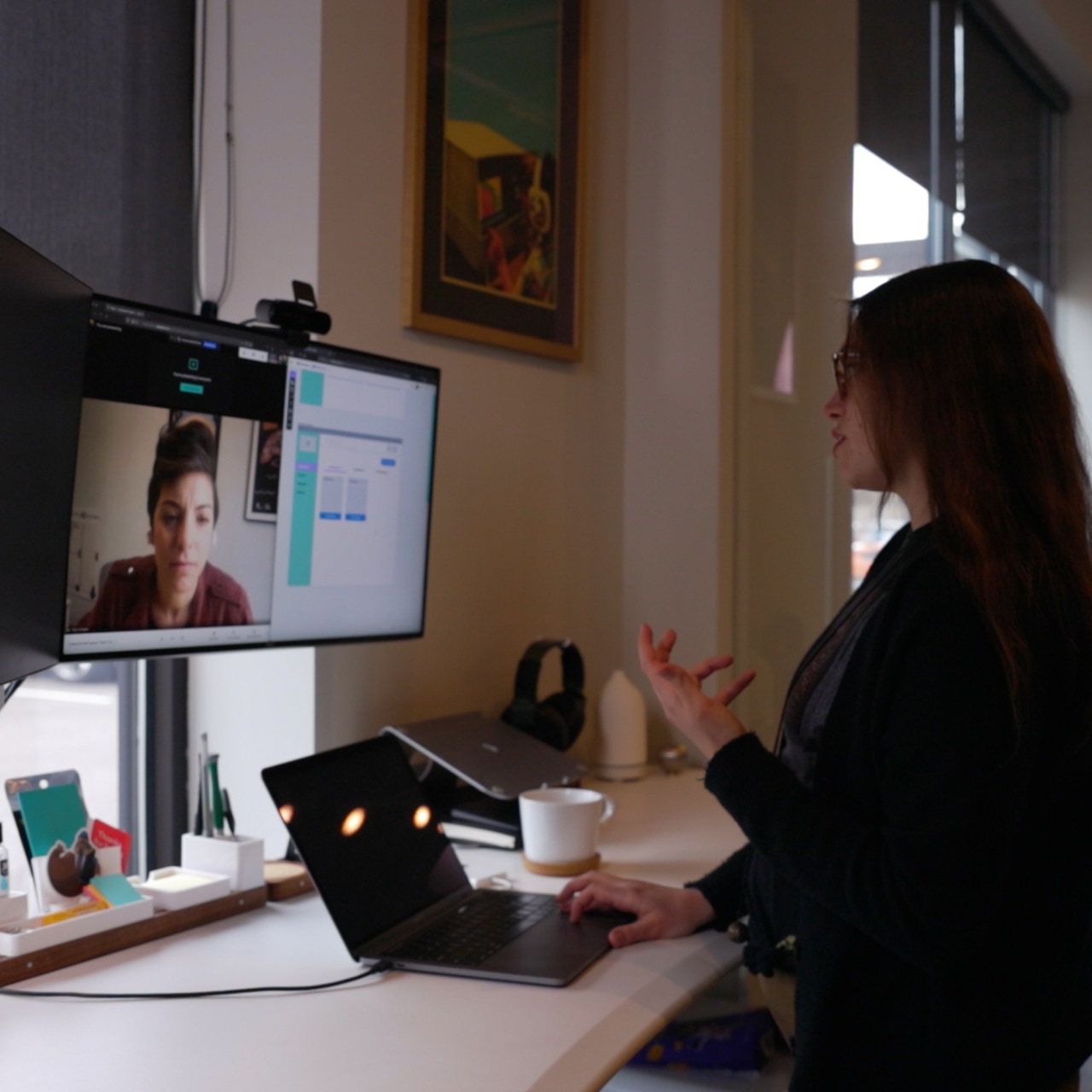 Emily demos a JavaScript project to a client in a virtual meeting from Cuttlesoft Denver HQ.