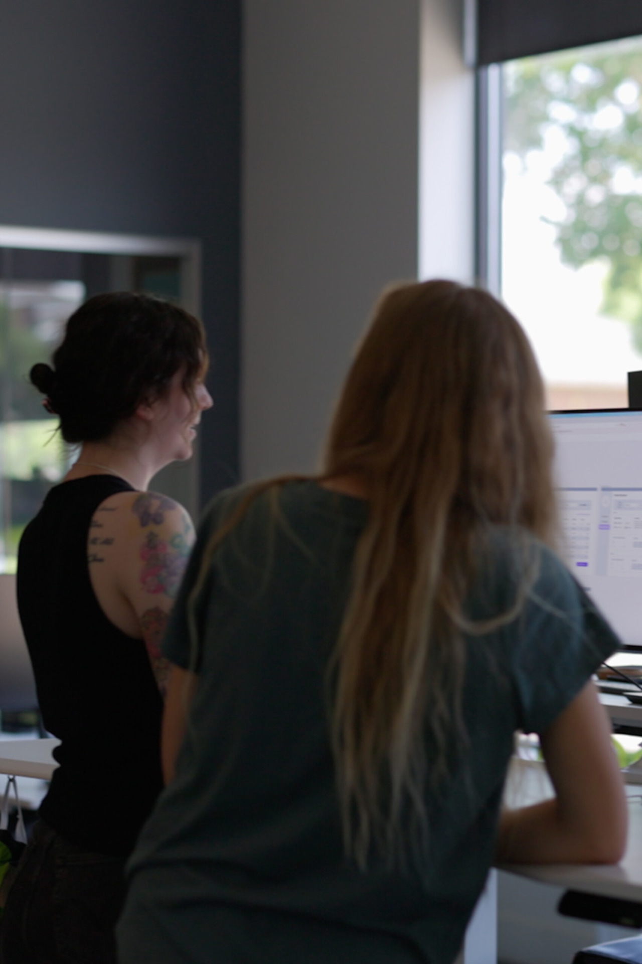 AI development team members at Cuttlesoft collaborate on machine learning model training, examining data annotation results for a computer vision project. The pair programming session demonstrates our collaborative approach to AI development, combining expertise in model development and data training. Their focused work represents Cuttlesoft's hands-on methodology for AI consulting, where developers work directly together on everything from NLP systems to deep learning implementations. The natural lighting and comfortable workspace reflect our approach to complex AI development - creating an environment where technical expertise meets practical problem-solving for enterprise AI solutions.