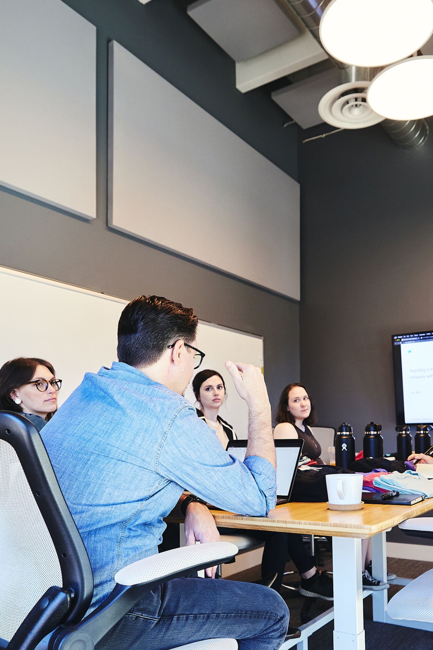 The Cuttlesoft team gathers in our Denver office for a new SaaS project brief.