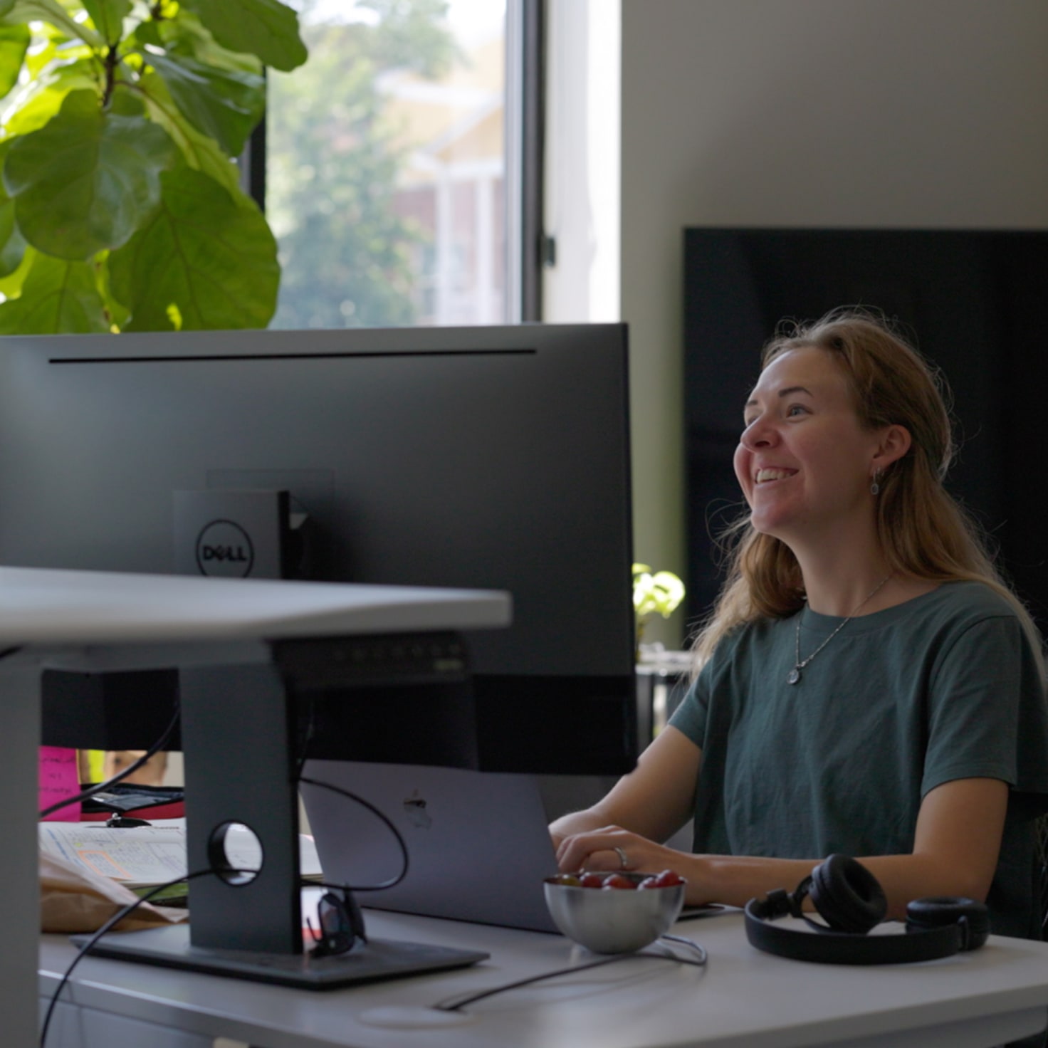 Sara talks with developers about an upcoming sprint for a project that's deployed using Kubernetes on GCP.